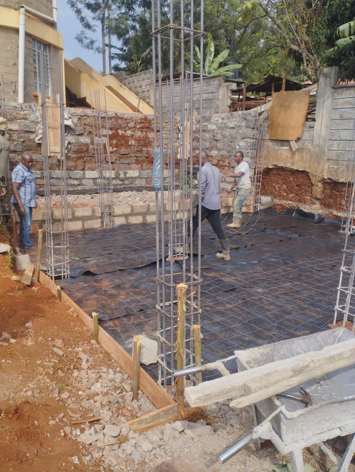 Ephravilla construction team setting column starter bars on a residential project site